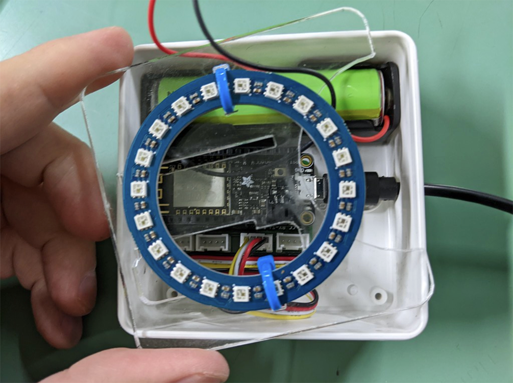 LED actuator: opened electrical connection box with electronic components including LED lamp ring.